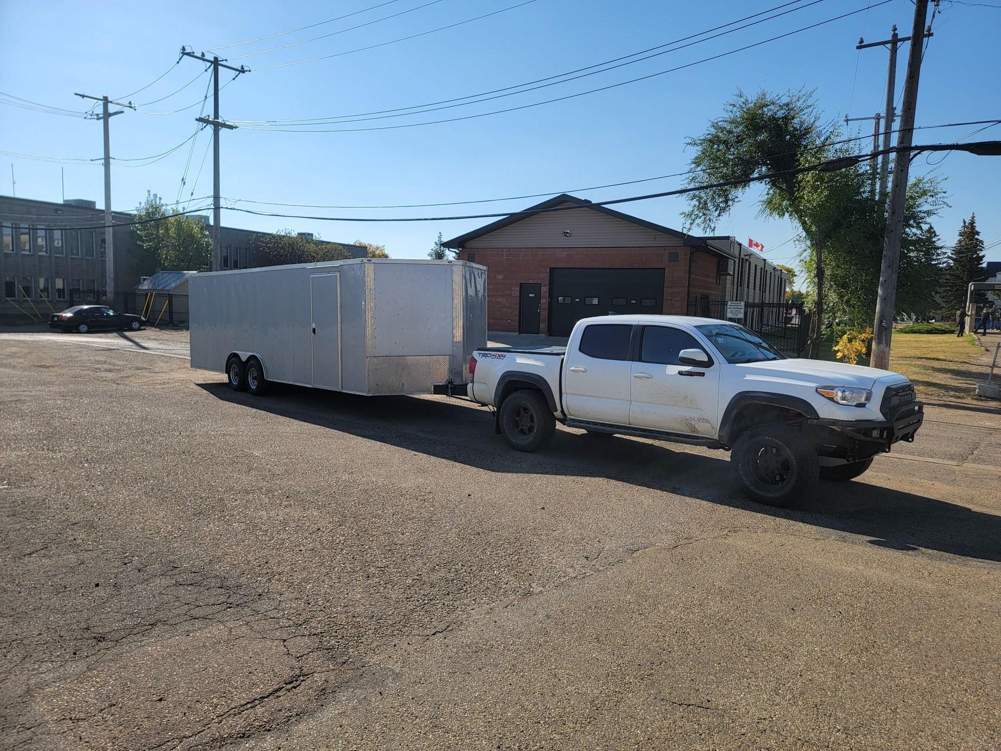 Blackout Solutions hauling equipment on a gooseneck trailer